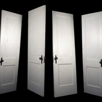Six white doors against a stark black background